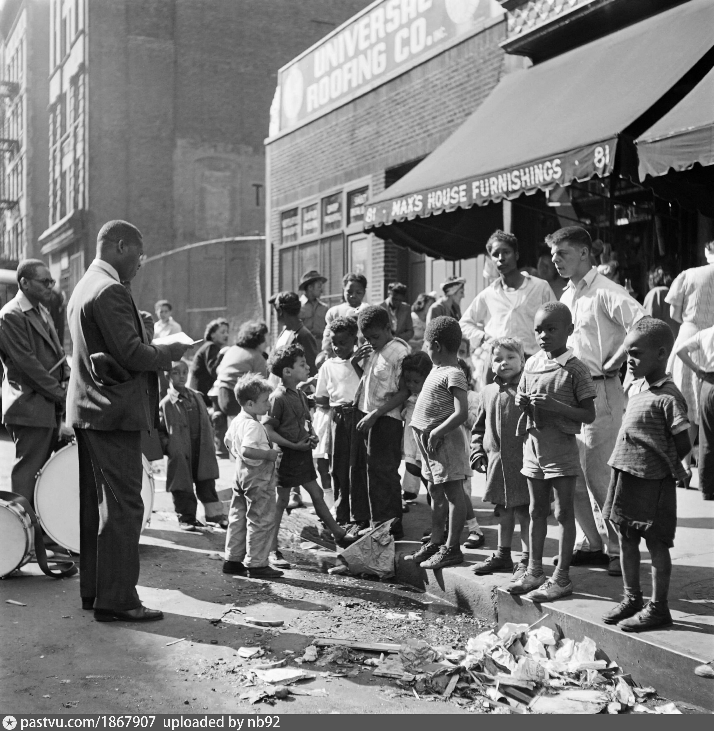 Children watch a singer and musicians performing