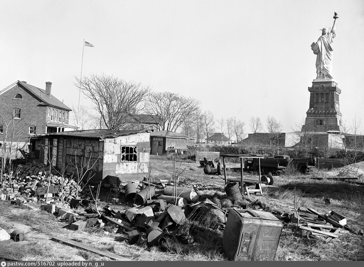 the-statue-of-liberty-stands-amidst-junk-and-trash-on-bedloe-s-island